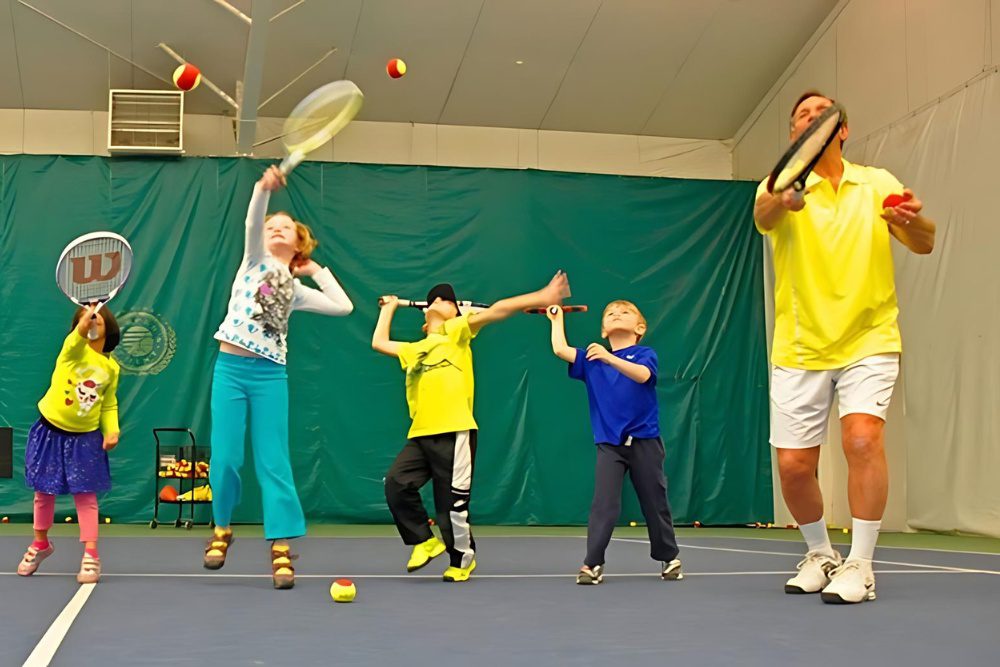 youth tennis players work on their game with coach contardi at a tennis camp at the club at harpers point